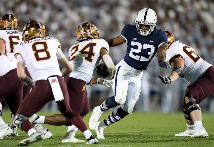 Oct 22, 2022; University Park, Pennsylvania, USA; Penn State Nittany Lions linebacker Curtis Jacobs (23) pressures Minnesota Golden Gophers running back Mohamed Ibrahim (24) during the third quarter at Beaver Stadium. Penn State defeated Minnesota 45-17. Mandatory Credit: Matthew OHaren-USA TODAY Sports